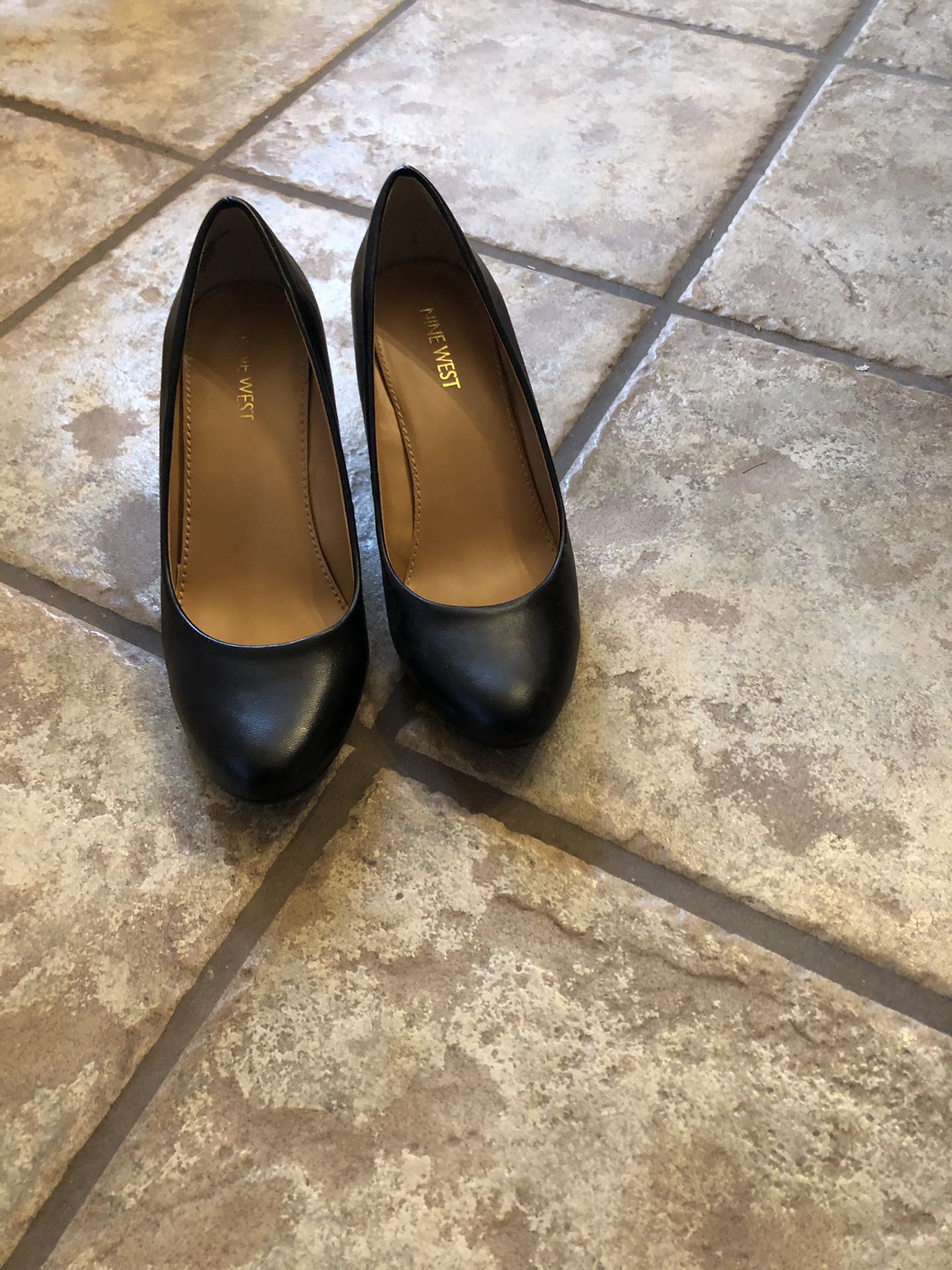 Nine West, black wedge heel pumps. 7 M. Only worn a couple of times.