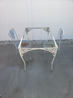 Vintage wrought iron patio table and chairs