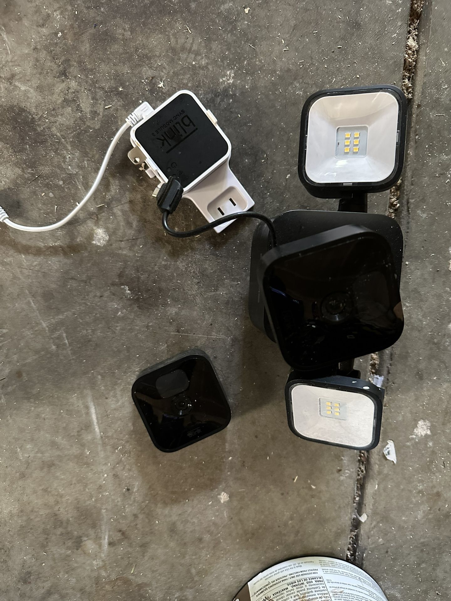 1 Blink Flood Light With Camera. 1 Outdoor Camera. 1 Doorbell Camera. 2 Modules.