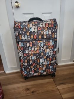 Rolling suitcase with dog print