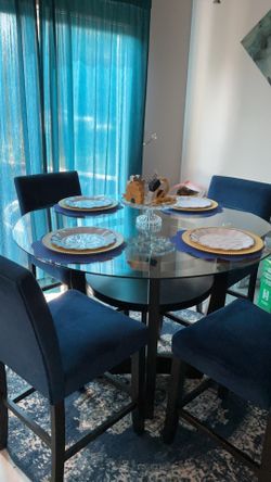 Glass table with 4 chairs