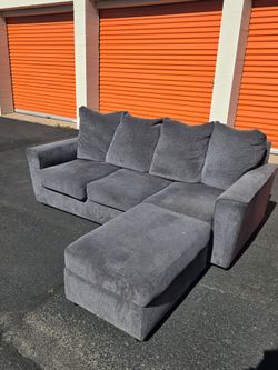 Grey couch with ottoman.