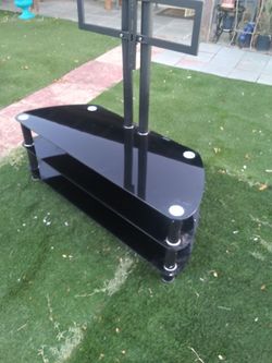 Tv. Stand.  Black Glass.    48" Inches. Wide.      $   55. 