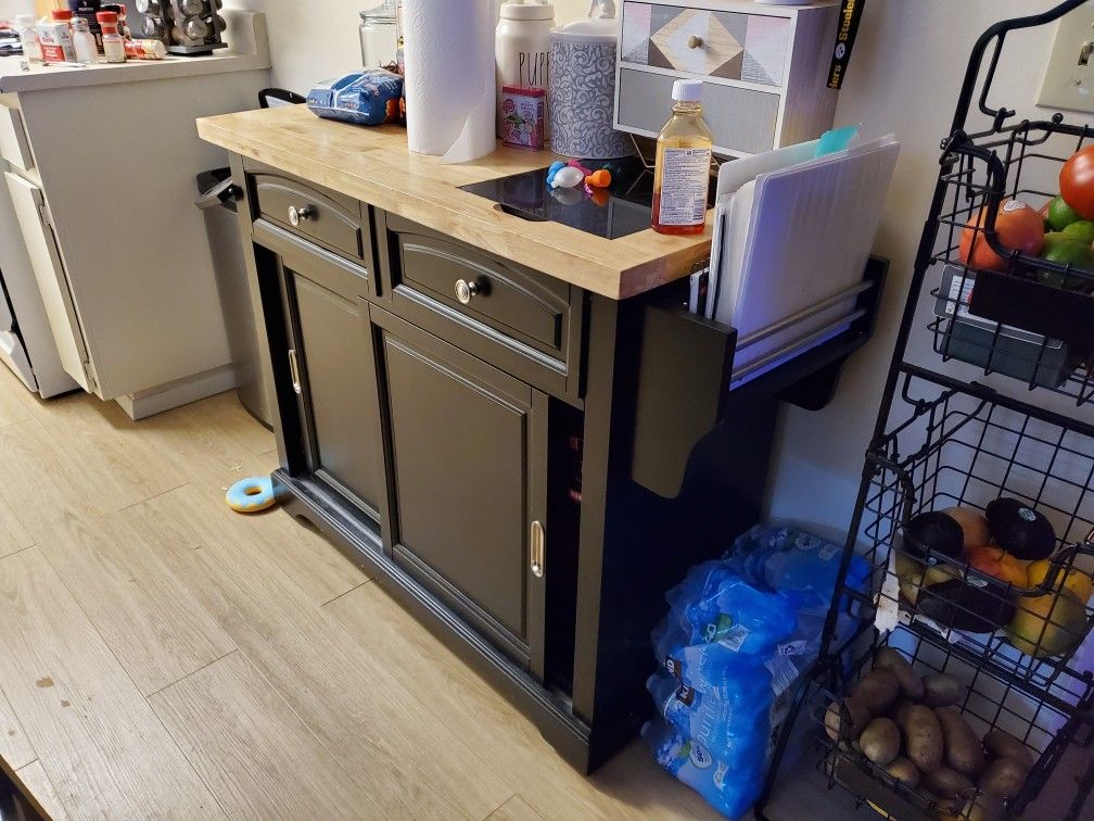 Kitchen island with with cutting board
