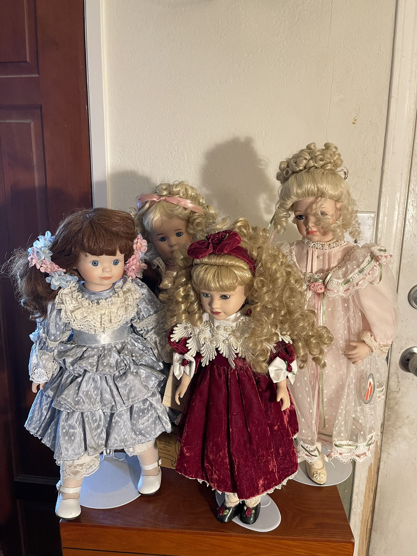 4 Beautiful Porcelain Dolls