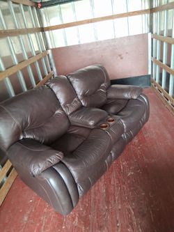 Beautiful double seated , recliner , with cup holders and compartment