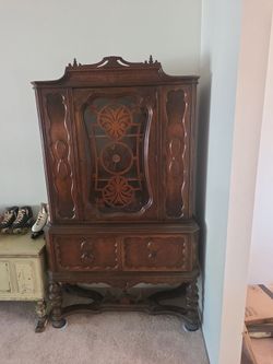 Spanish revival walnut China cabinet.