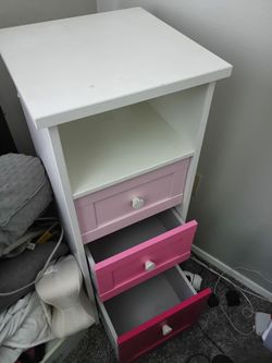 Pink three-drawer side table storage