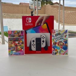 Nintendo Switch Oled with super Mario party and Mario kart deluxe 8 floor model 