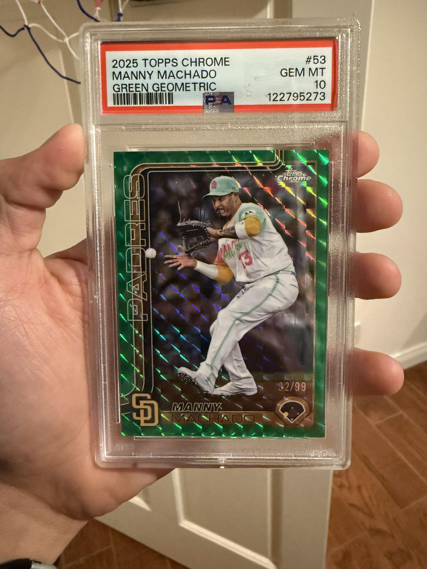 2025 Topps Chrome Manny Machado Green Geometric Refractor, serial numbered 32/99 and graded PSA 10 GEM MINT.