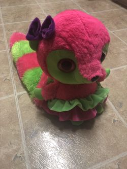 Bright green and pink stuffed lemur
