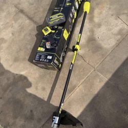 RYOBI 40V 15 in. Expand-It Cordless Battery Attachment Capable String Trimmer with 4.0 Ah Battery an