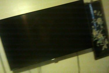 60 inch smart TV with it's oringal remote