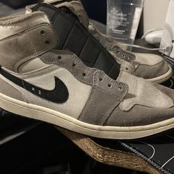 Grey and white Jordan 1s