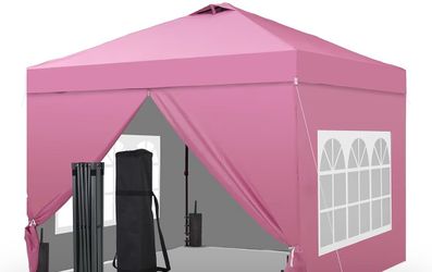 Pink canopy brand new with four walls with windows and 4 sand bags and carrying case on wheels perfect for ALL occasions