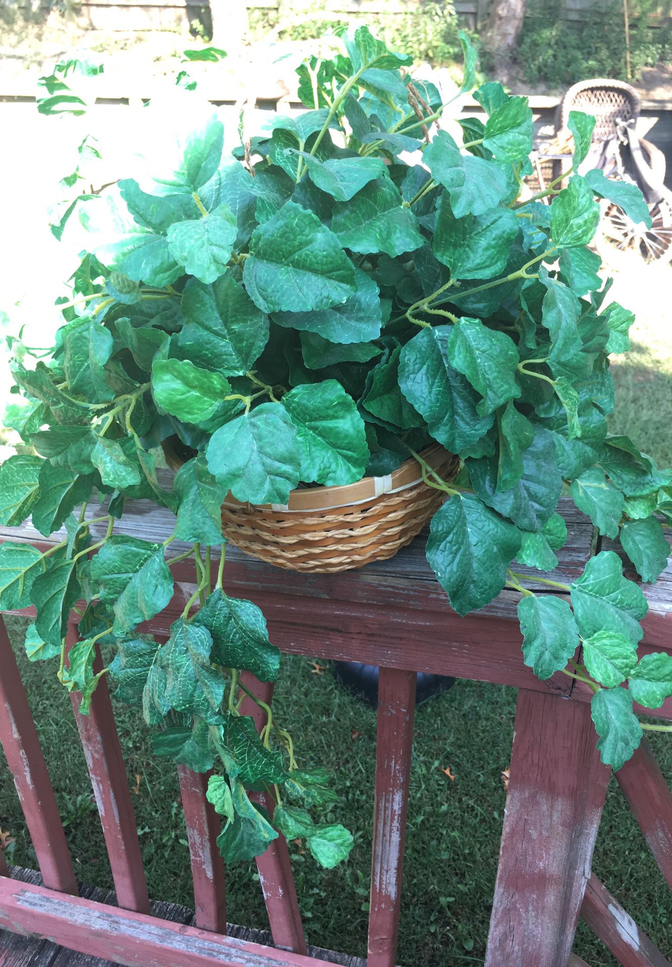 Artificial plant with hanging basket
