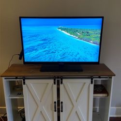 TV + Stand/cabinet