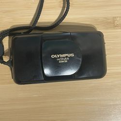 Olympus Infinity Stylus Zoom DLX 35mm black film camera  flash zoom shutter working. Ran test film through it and is winding properly. Have not develo