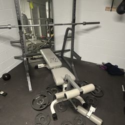 Squat rack with weight holders /45lbs bar and weight 300lbs/ bench with leg extension