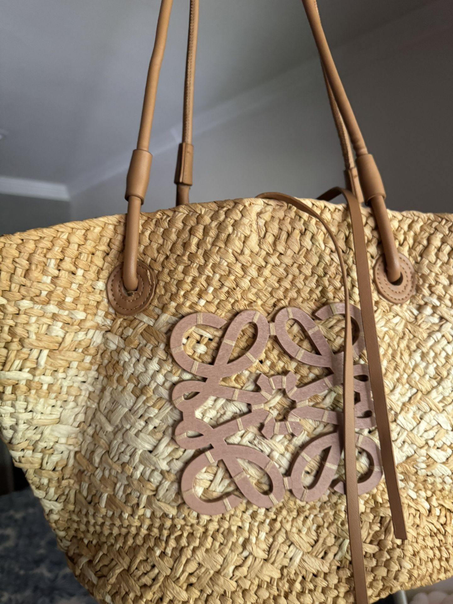 Medium Loew Anagram Basket bag in iraca palm and calfskin