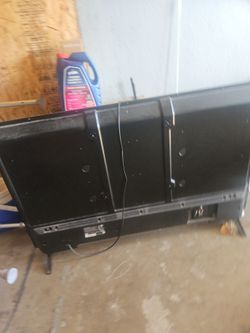 Black Flat Screen TV with Stand