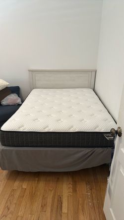Almost new twin mattress with frame and headboard