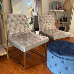 Soft gray velvet accent chairs with gold legs