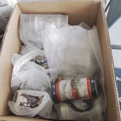 Box of antique steins and mugs