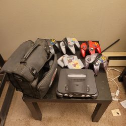 Nintendo N64 With Controllers Plug Ins And Carrying Case