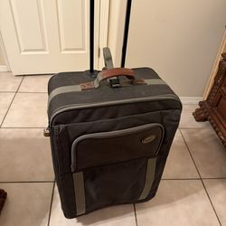 This product is an American Tourister soft-sided wheeled suitcase
