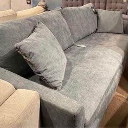 Sofa with pullout double sleeper by Serta floor model