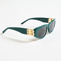 Sunglasses with a gold logo. Brand new.