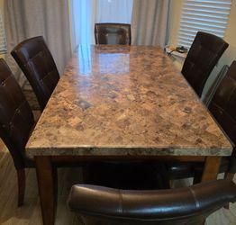 Stone dinning table and six chairs