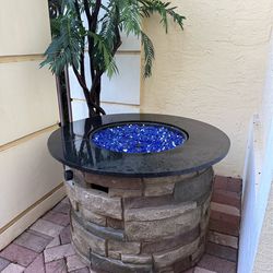 Round Stone Fire Pit and Blue Glass