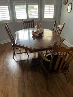 Dinning room table and 4 chairs  sold Oak.Table  is 4’L w/ leaf x 6L x 28” H