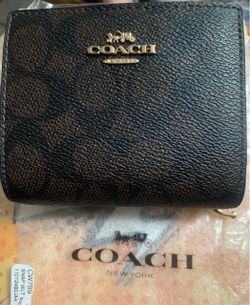 New Coach Wallet has many places for cards, coins, cash. Sells for 60+ tax