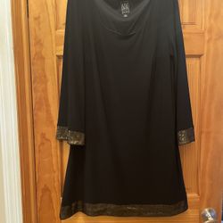 Dress for women, straight fit. Gold trim on the bottom and sleeves. The dress is in great condition. Color black size 14. Made in USA