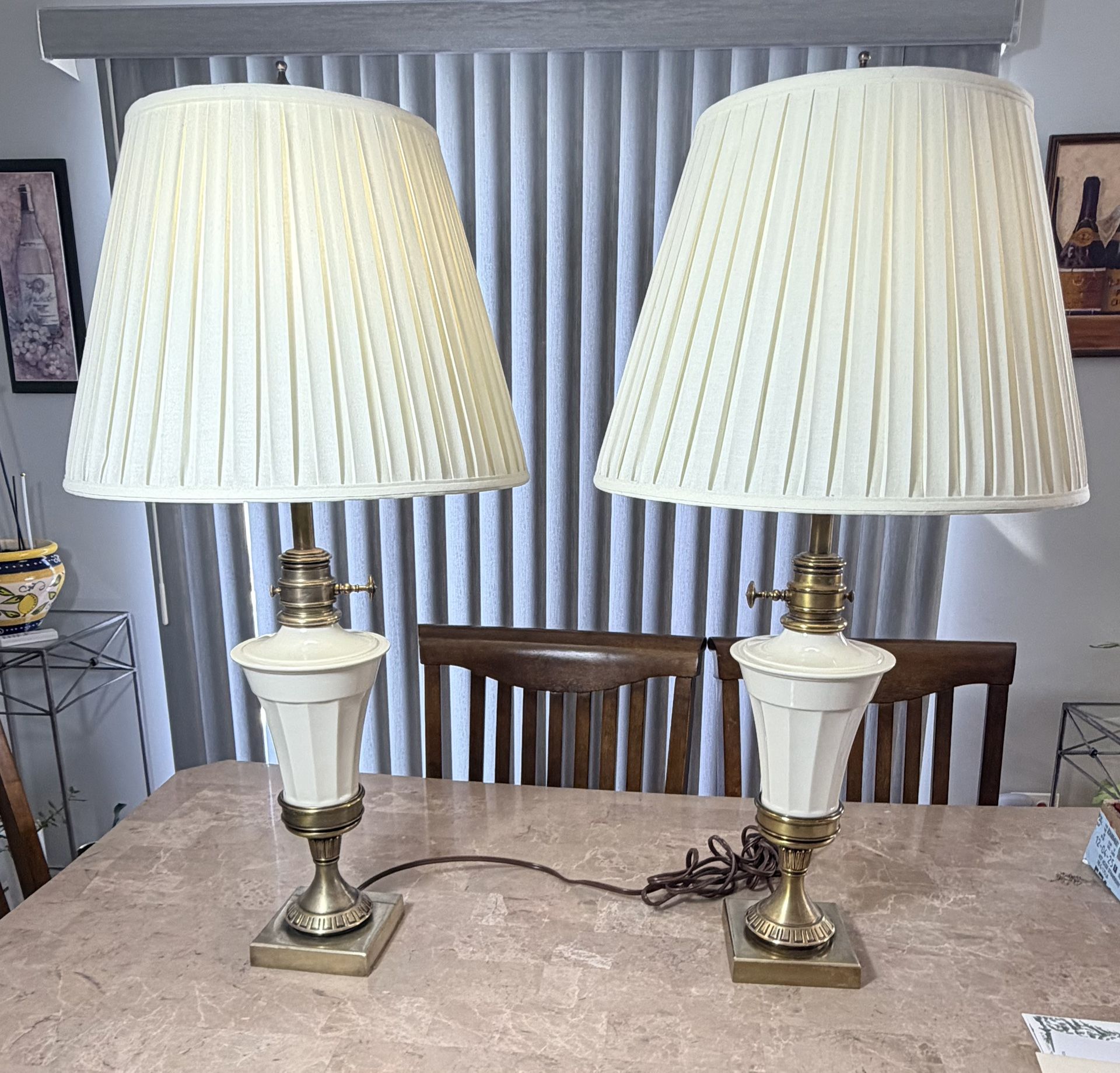 A pair of Beautiful Stiffel Brass table lamps with Lenox Ivory colored Ceramic and you can place them with glass or the pleated shades.