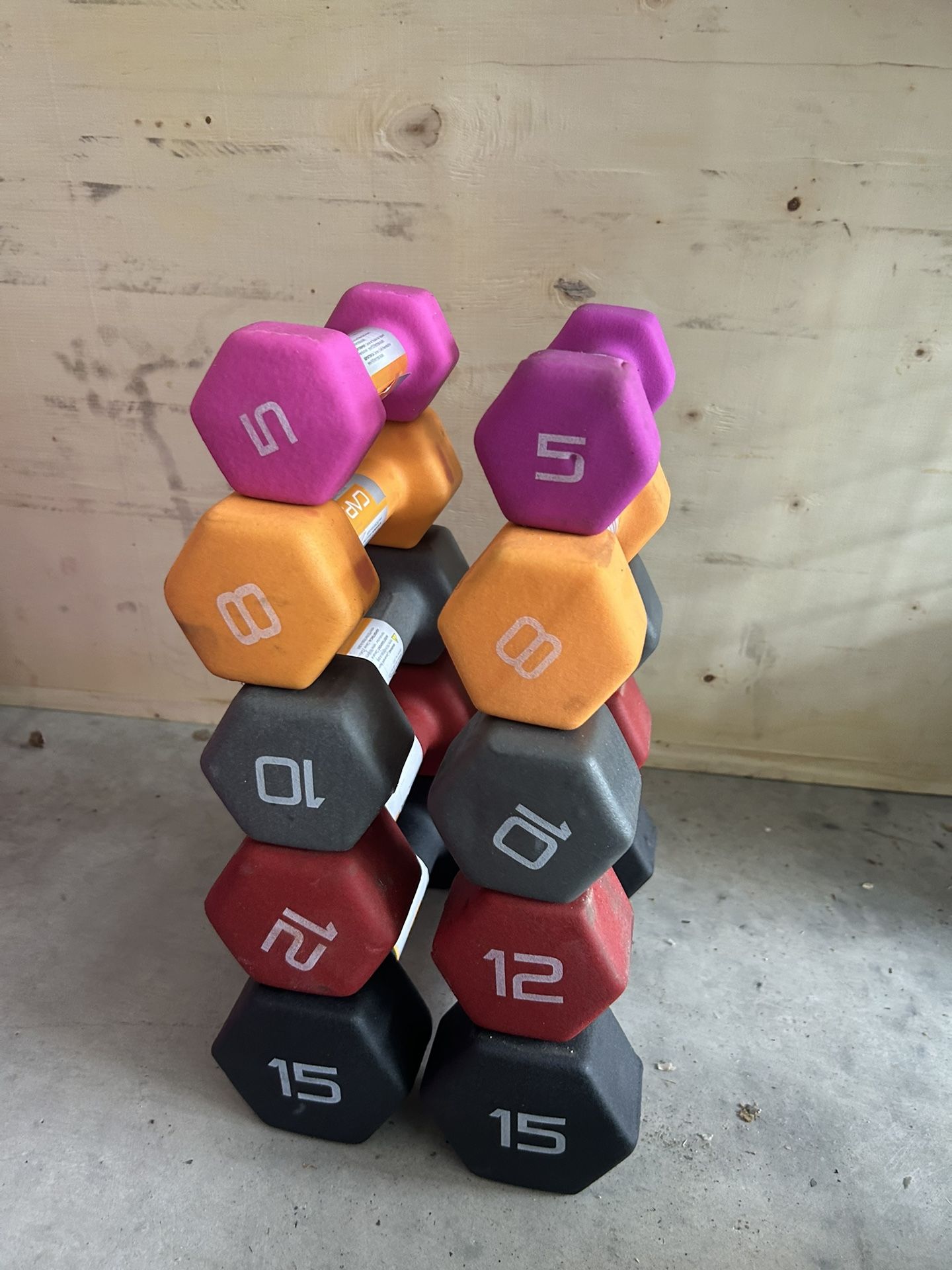 New pair of 5,8,10,12,15lb neoprene dumbbells with cuts in the neoprene