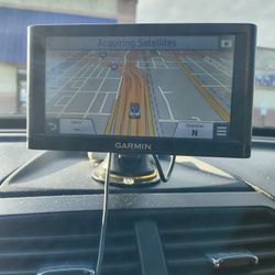 2 Garmin Auto GPS System. 