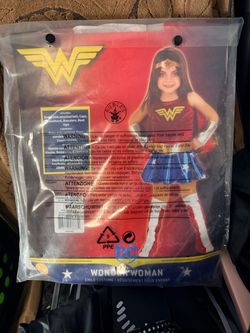 Wonder Woman Child Costume. Look brand new. Just $12.  dress with attached belt, cape, headband, bracelets, boot tops. Brand: Rubie's. Between 8-12 yo