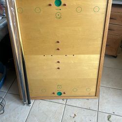 Carom board with pool cues