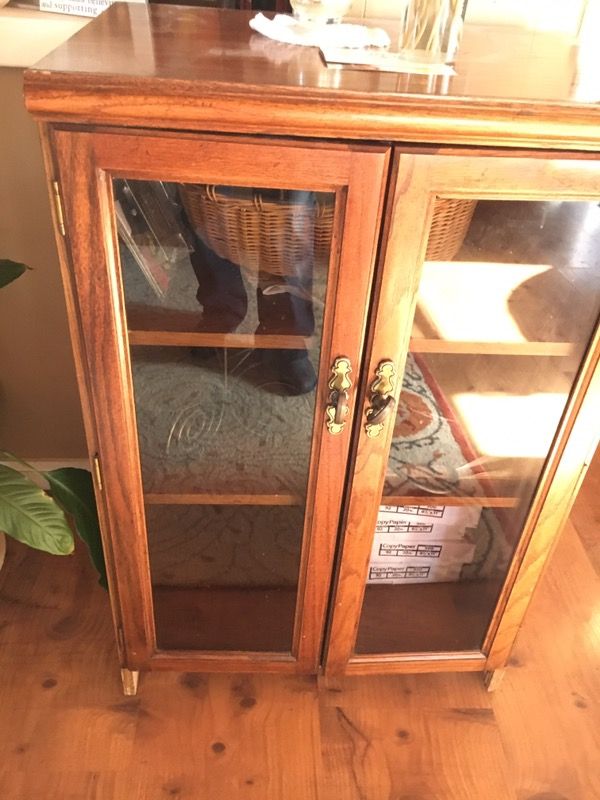 Oak cabinet with glass front doors