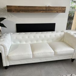 White faux leather sofa