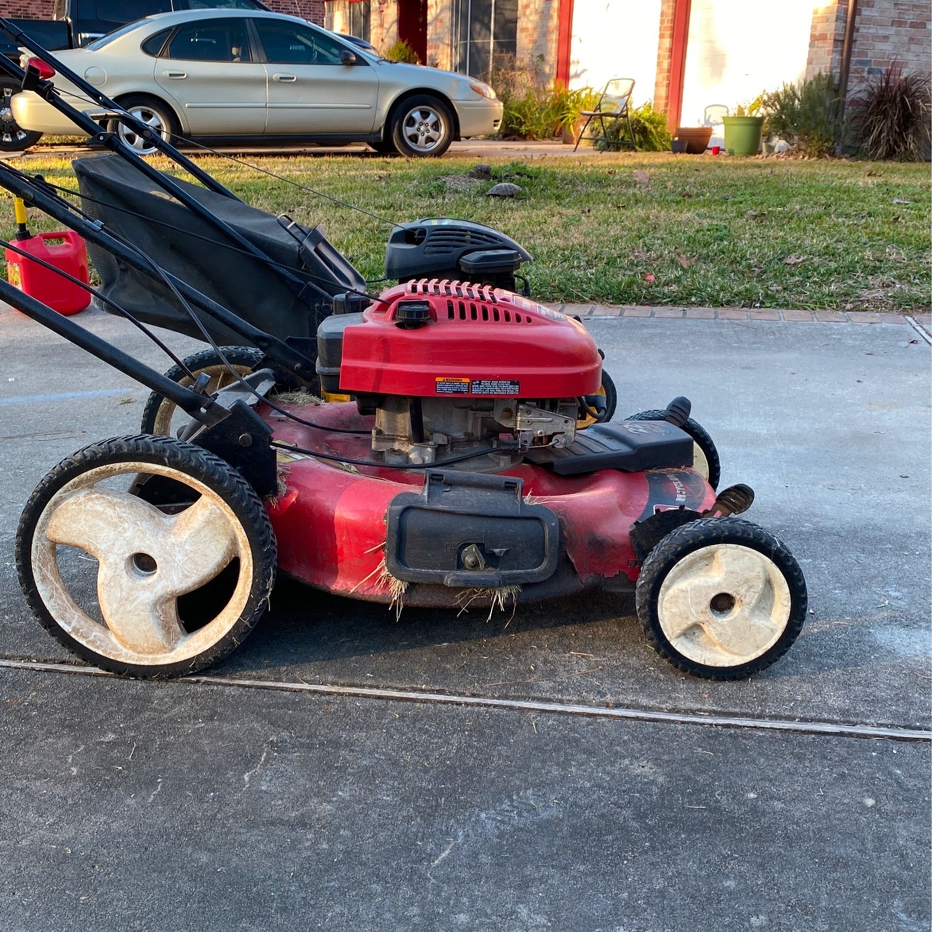 Two Running Lawn Mowers