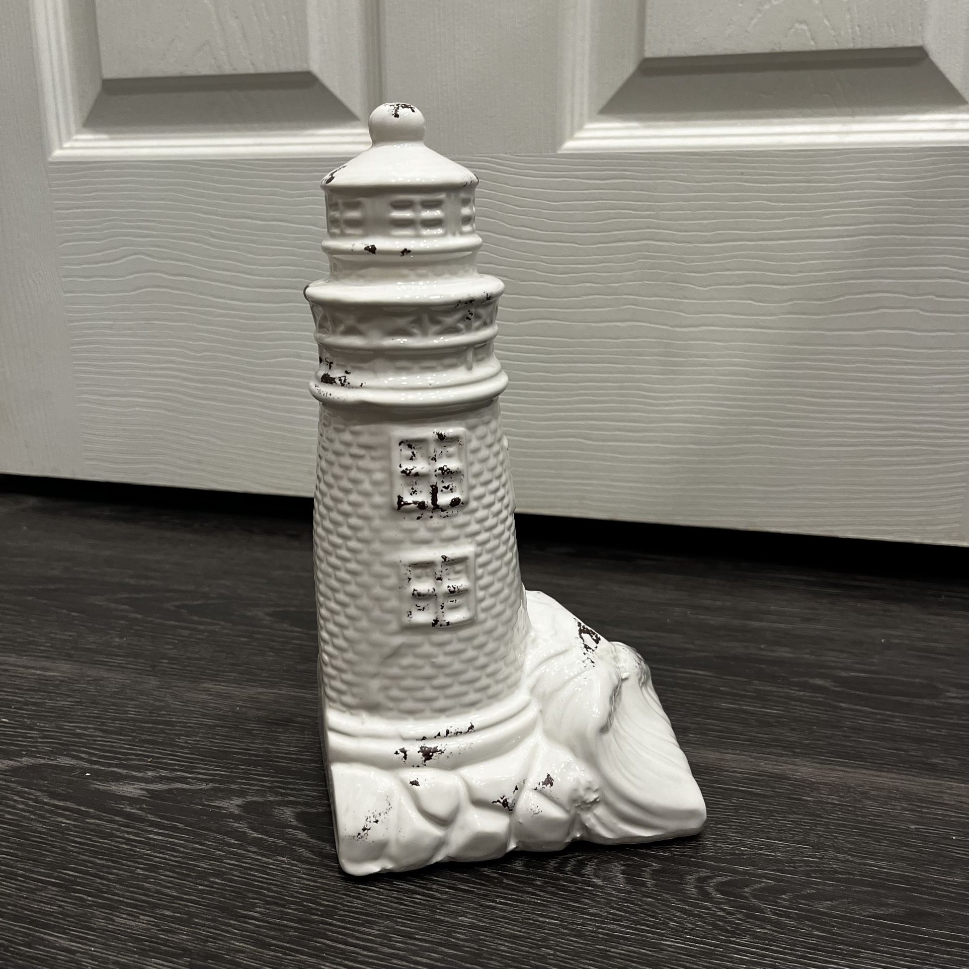 decorative lighthouse figurine, 9.5” tall