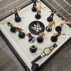 WWE Wrestling Ring With Vibrating Canvas & 12 Wrestlers Who Have There Logo Stamp On Bottom Of Feet 
