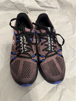 On Cloudsurfer running shoes.