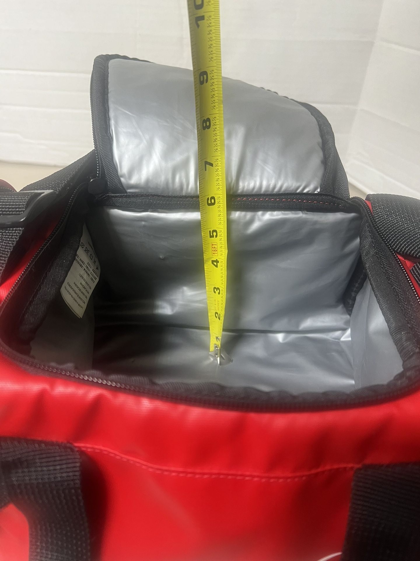 Nike Insulated cooler with pockets and Shoulder Straps Great Condition. Used in good condition with very minimal cosmetic blemishes with the major ble