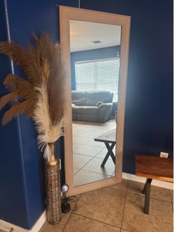 Mirror and metal vase with decor